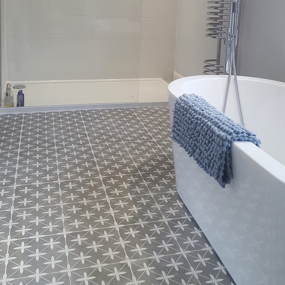 Grey patterned bathroom floor tiles