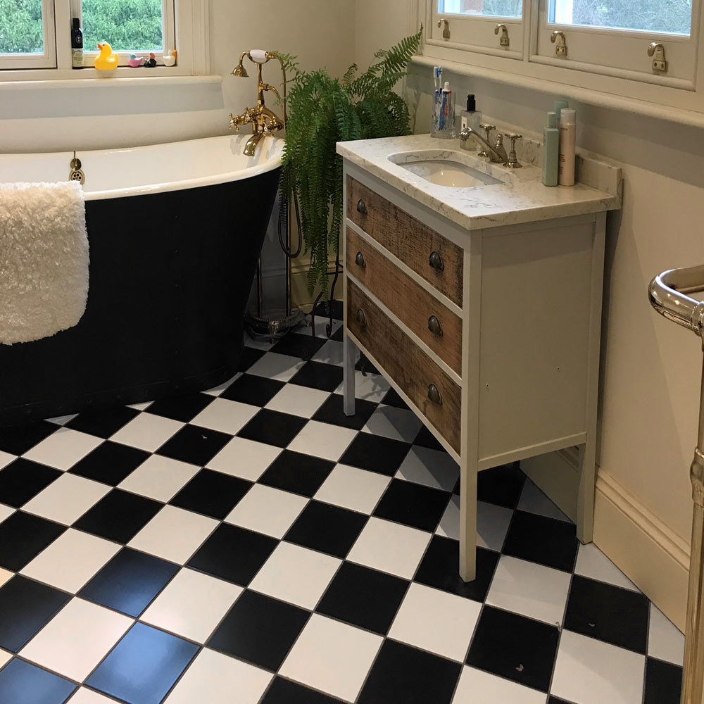 Black and white chequered bathroom floor tiles