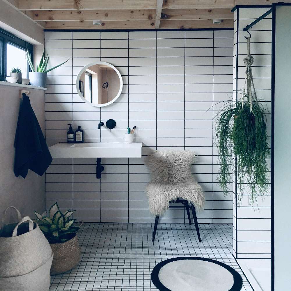 Kelly Made A Refreshing White Bathroom Using Brick and Mosaic Tiles