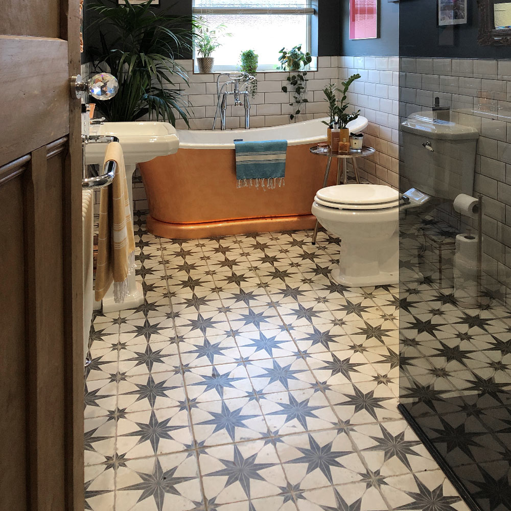Scintilla star patterned bathroom floor tiles