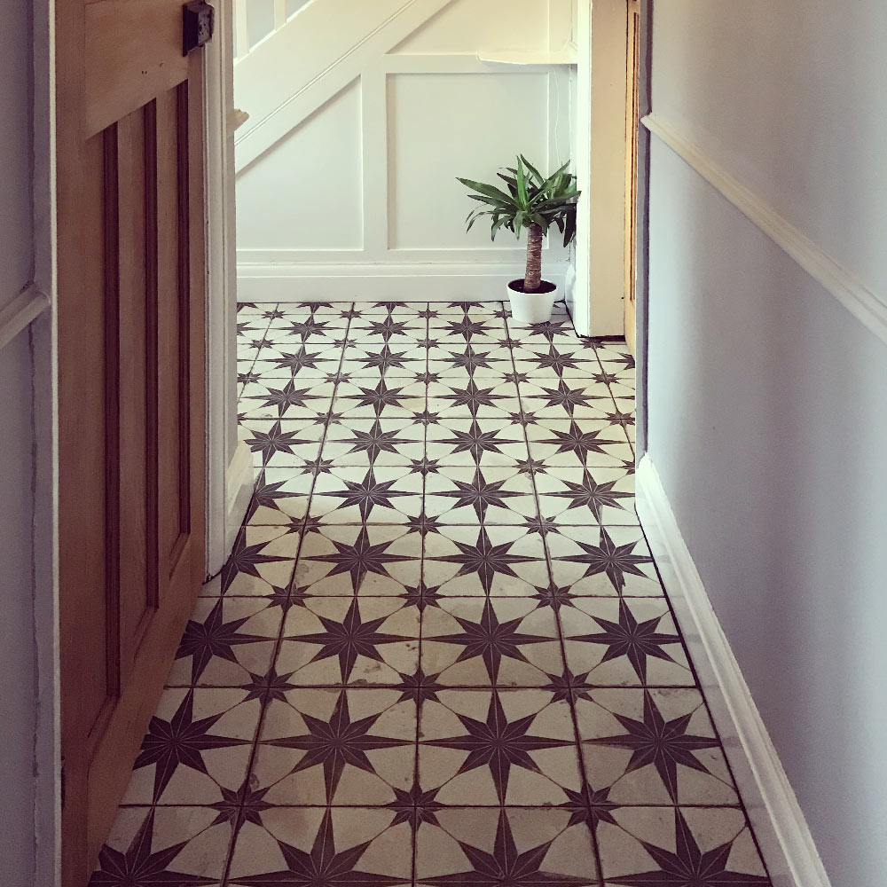 Scintilla patterned hallway floor tiles