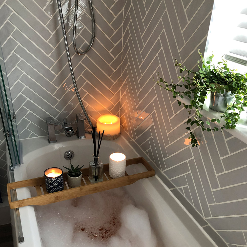 Bubble bath with grey rustic metro tiles