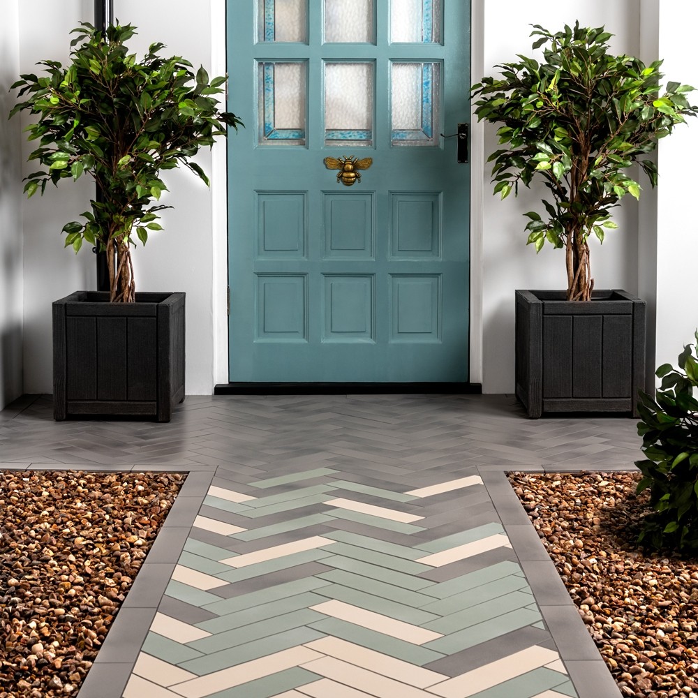 chatham tiles in the doorway in different colours in herringbone layout