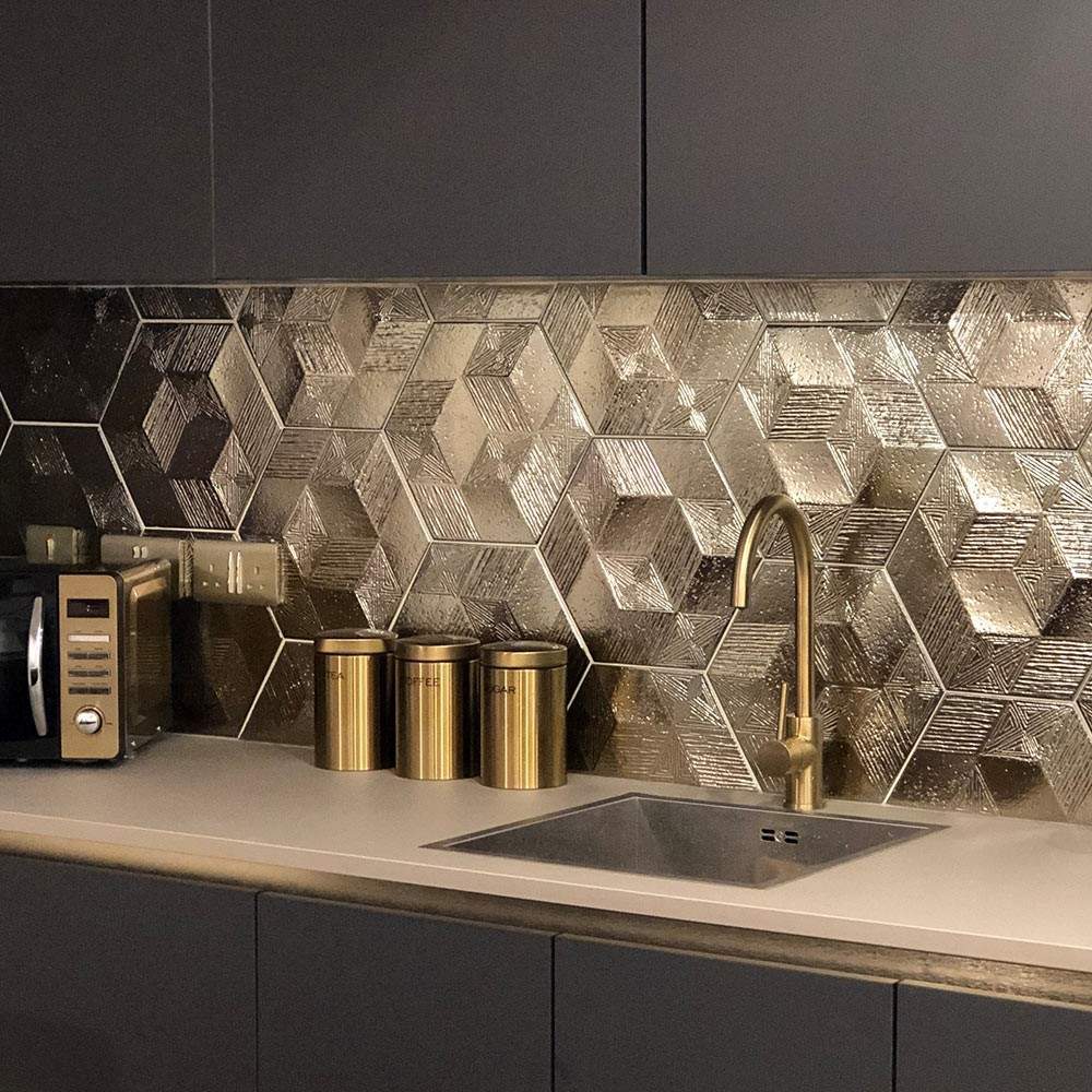 gold hexagon tiles as a splashback in a kitchen 
