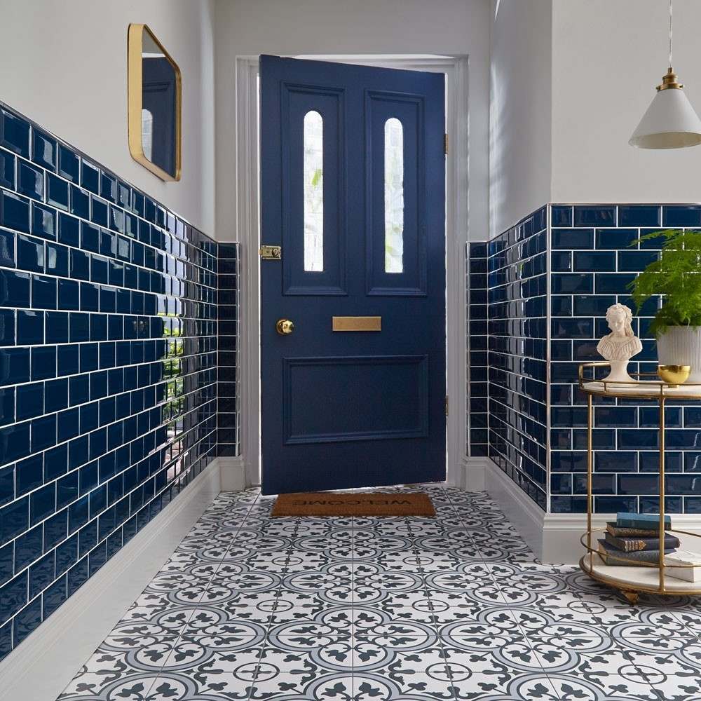 statement floor in blue with blue metro tiles on the walls