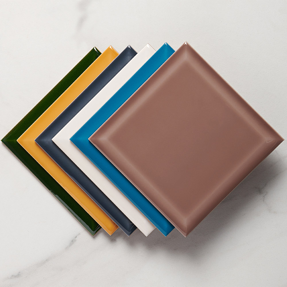 Capsule tiles in six modern heritage colours mixed together in a line with a deep translucent glaze and bevelled edges