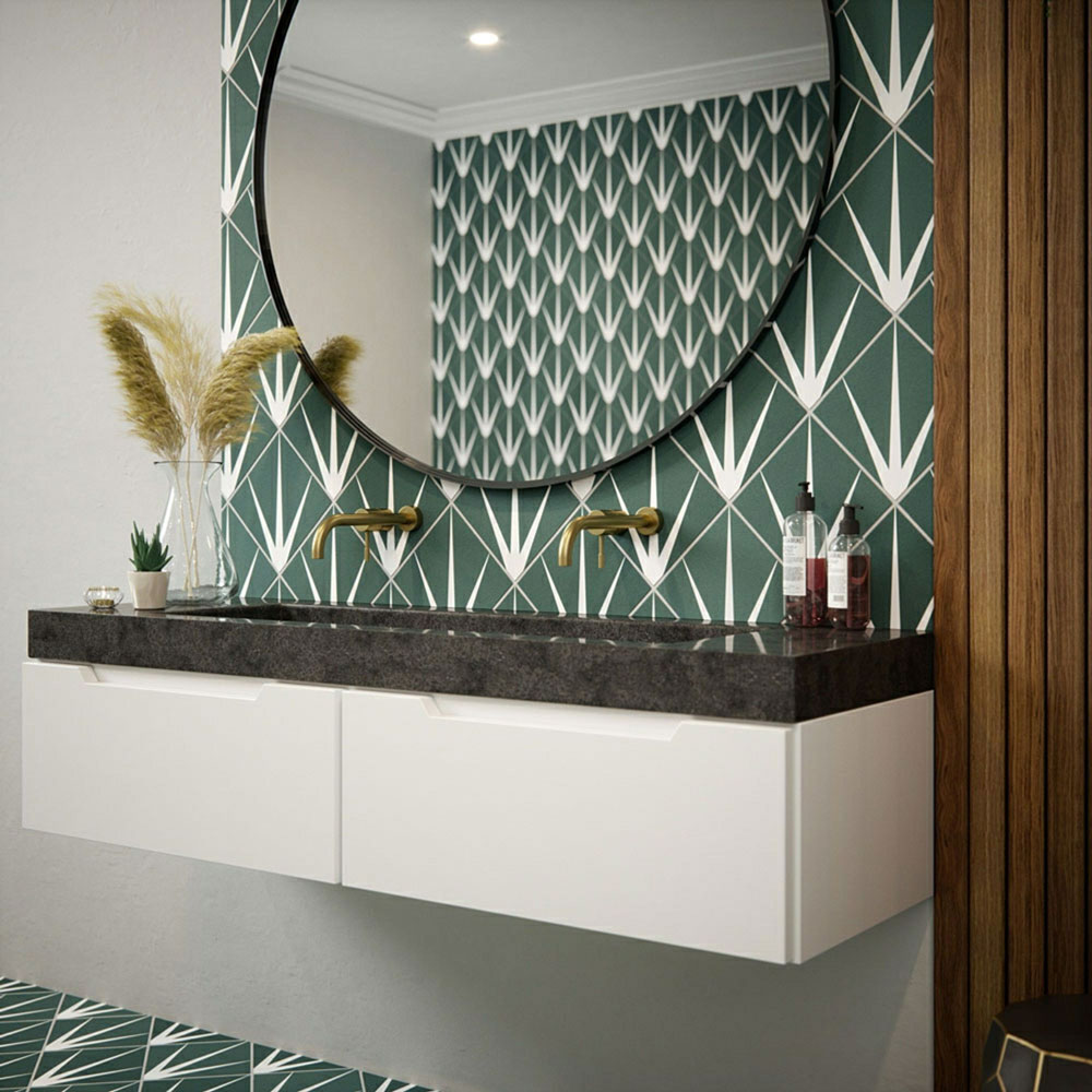 Dark green bathroom patterned bathroom space with large circular mirror over sink. 