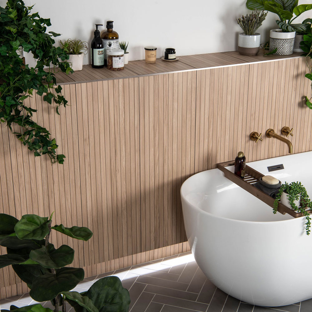 Wood effect slabs over bath space accessorised with houseplants and greenery. 