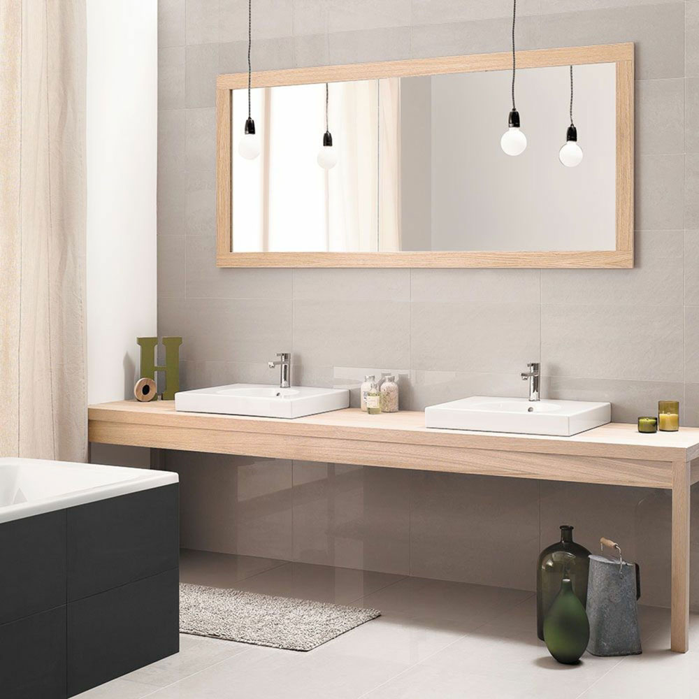 Neutral bathroom design with two sinks and single pendant lighting over sinks.