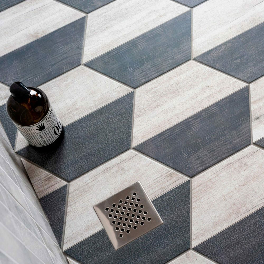 Close up shot of hexagonal blue and white striped flooring tiles. 