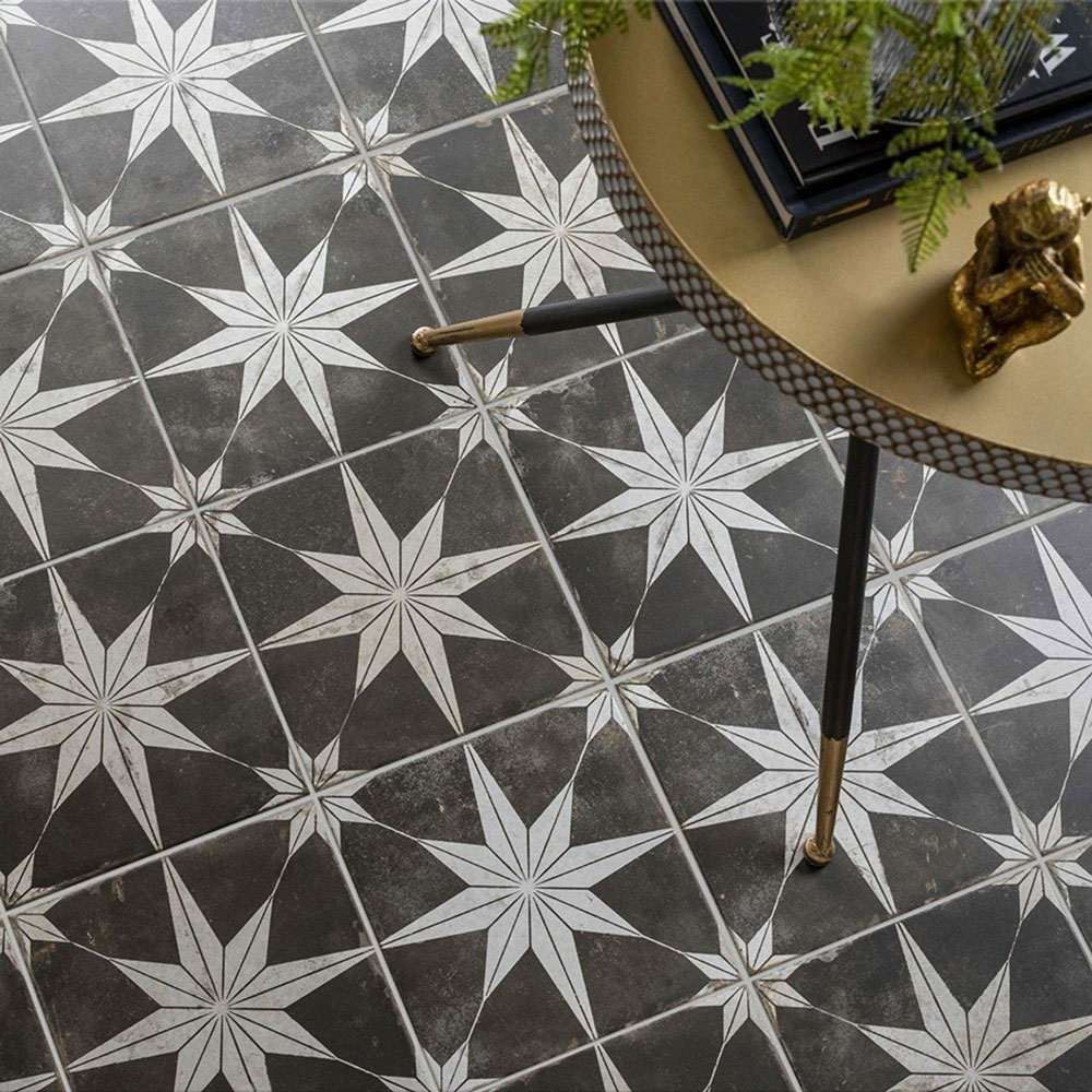 Black and white star patterned floor tiles.
