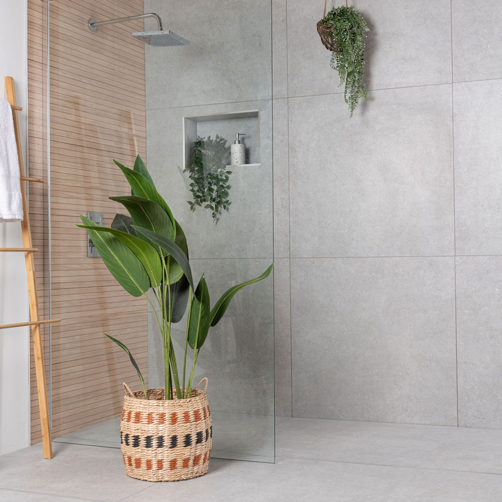 Underfloor heating wet room ideas with concrete effect tiles.