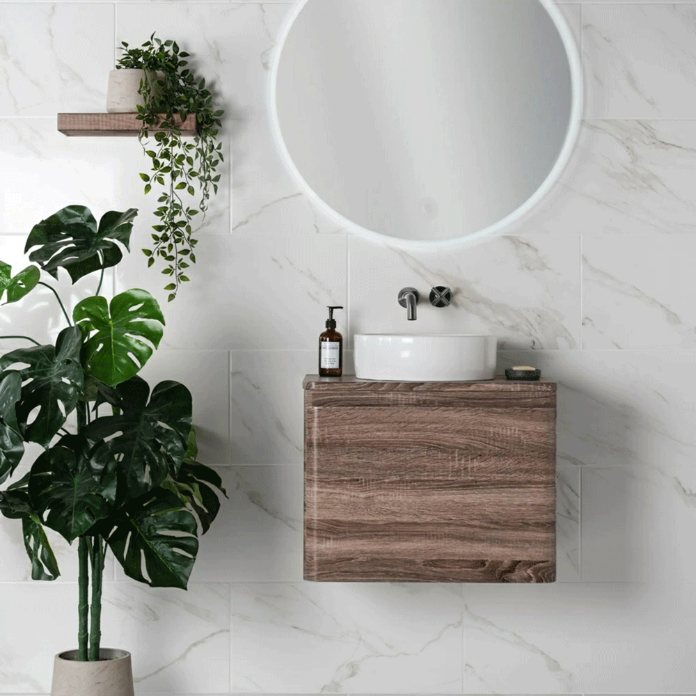 Home spa bathroom inspiration taken from the neutral marble tiles and wood textures throughout. 