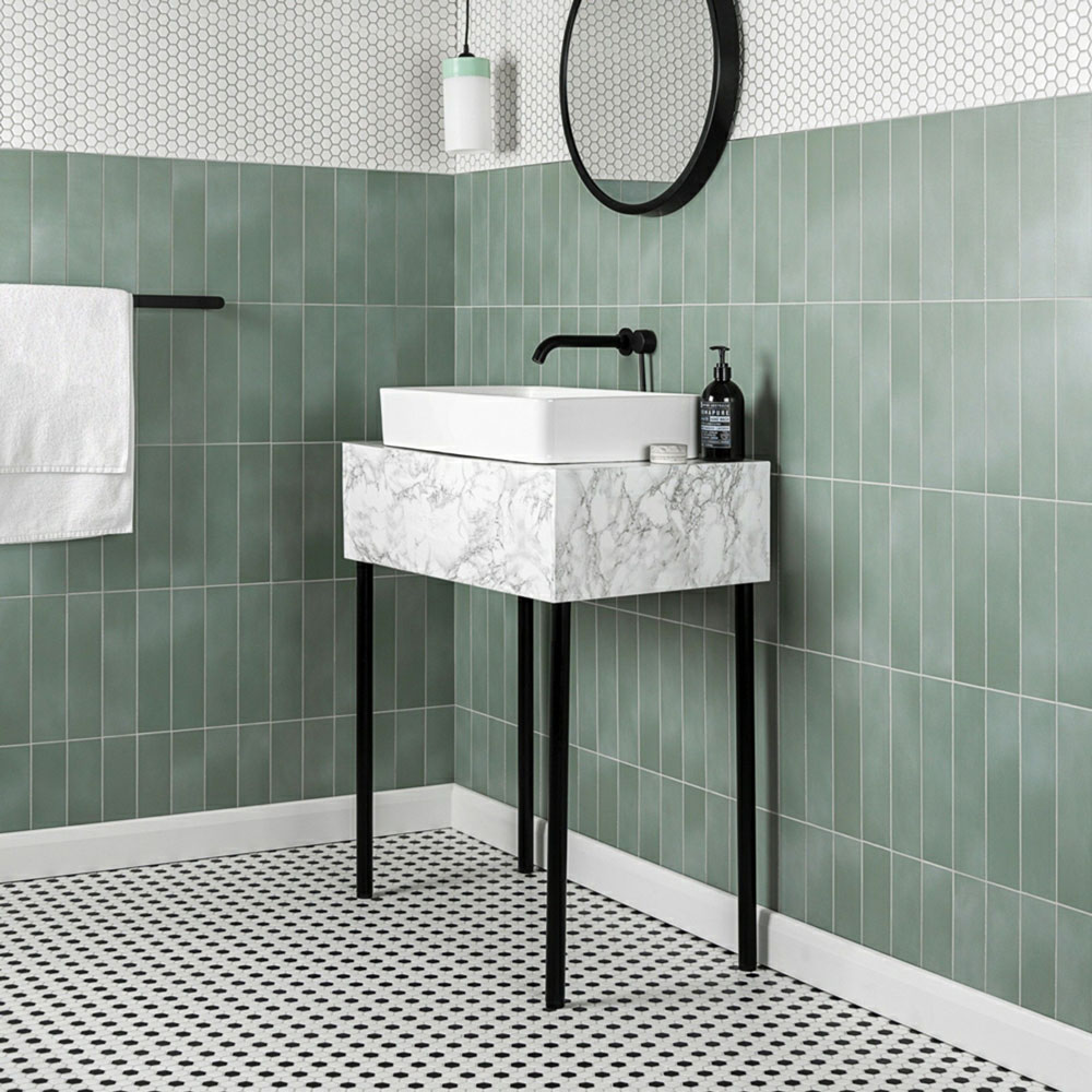 Muted jade green metro tiles in black and white bathroom. 