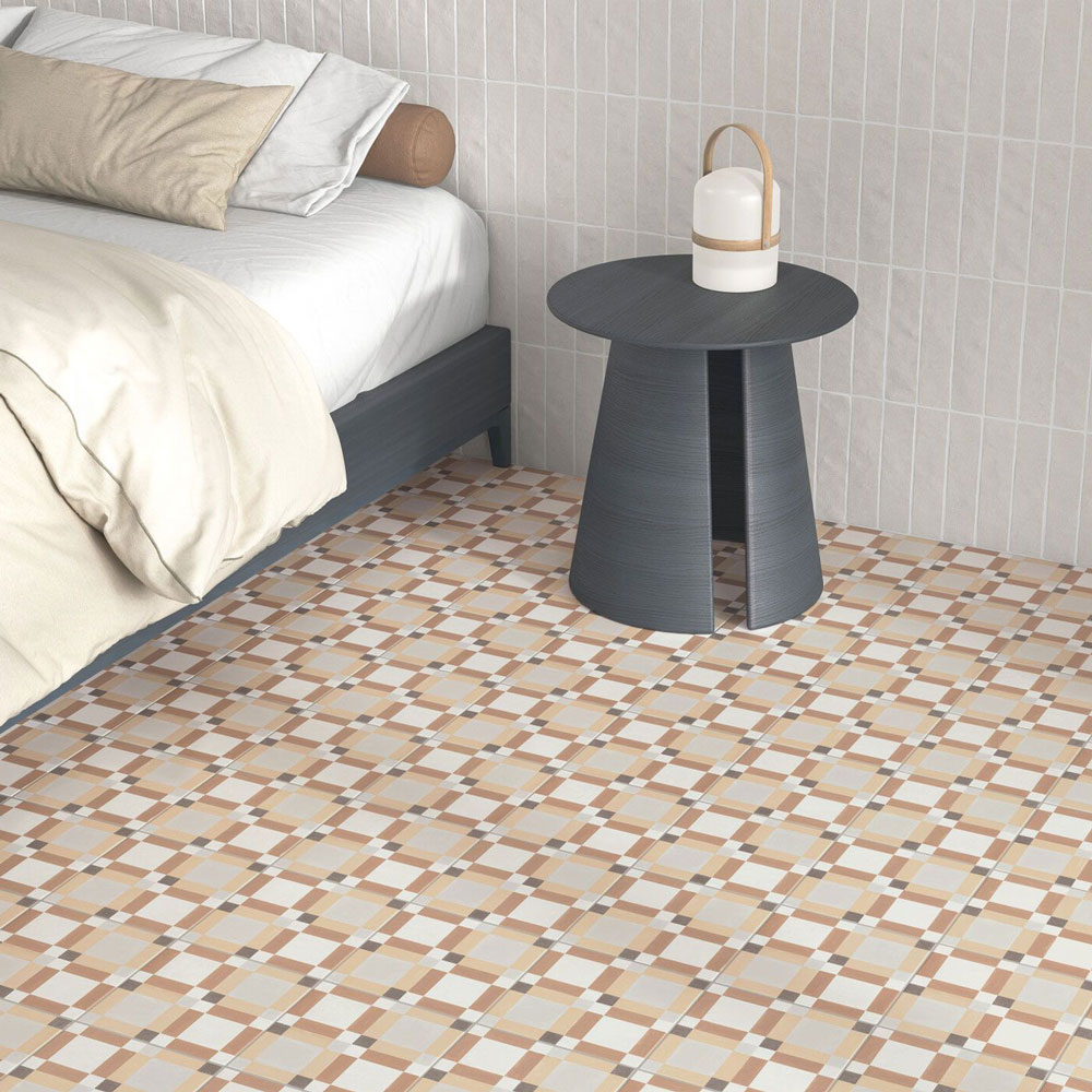 Patterned coloured tiles across bedroom floor with neutral colour scheme. 