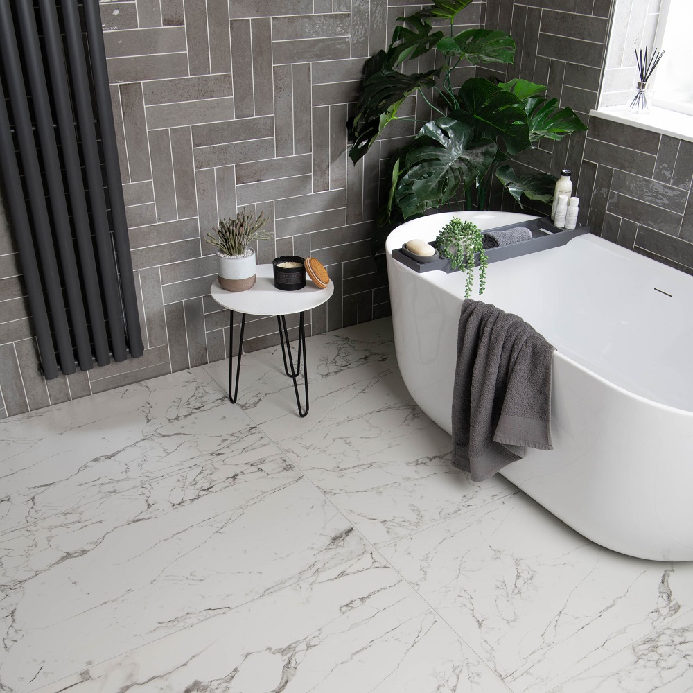 Faith grey gloss tiles with black radiator and white tub.