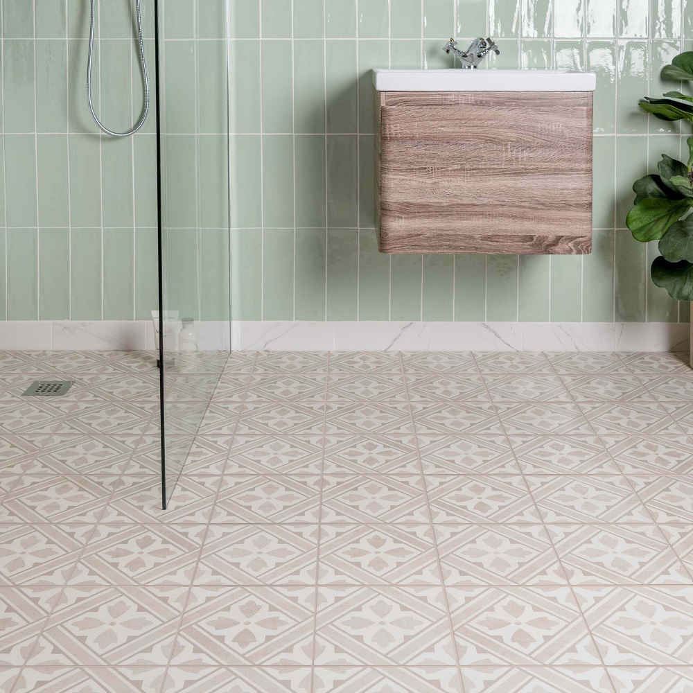 Moroccan bathroom flooring with mint green metro wall tiles in wet room area with wall mounted wood vanity basin unit. 